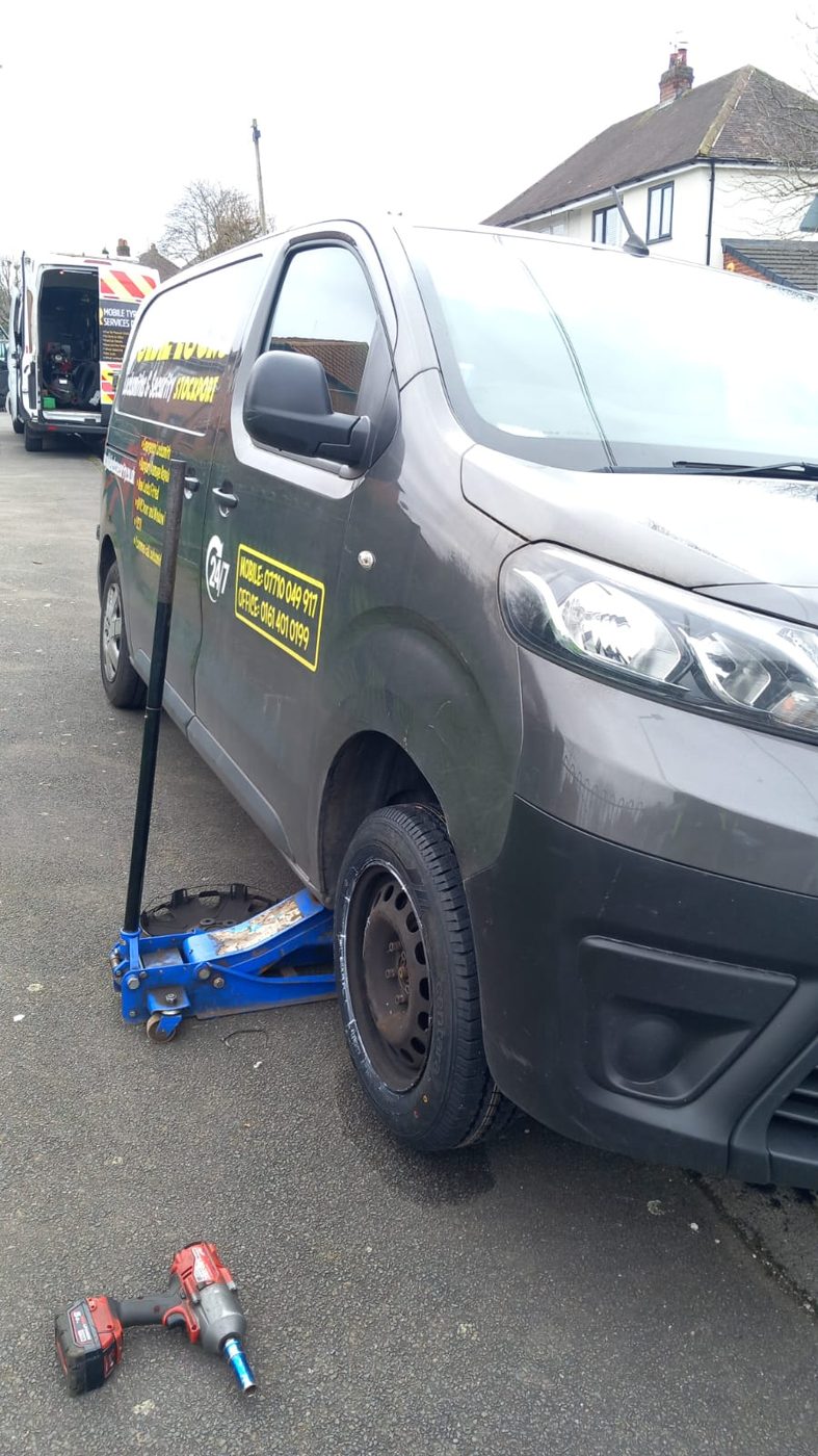 Wheel removed from a van ready for a new tyre